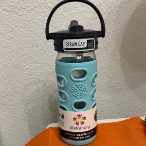 Lifefactory 12 oz reusable glass Bottle with straw cap teal
Silicone sleeve